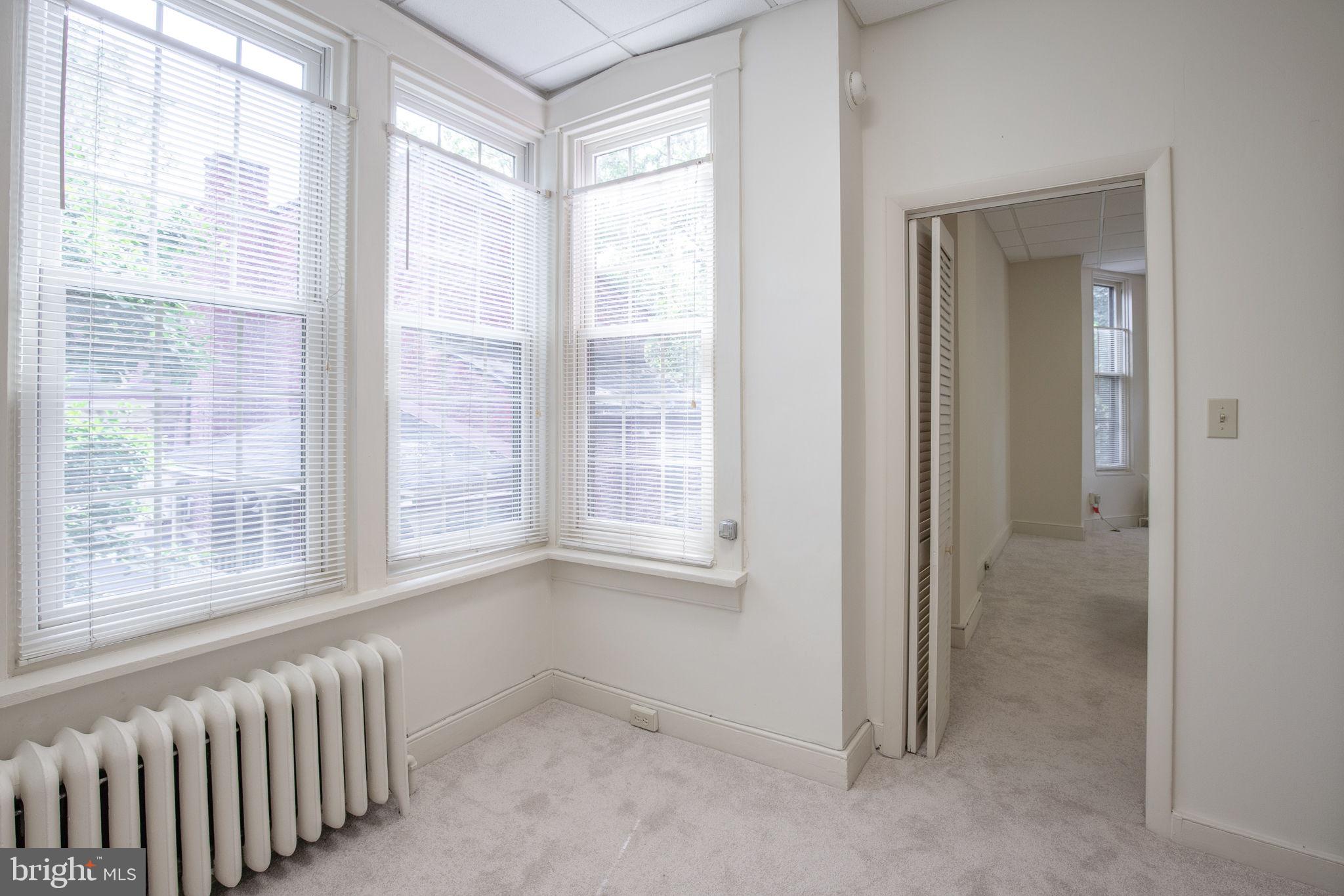 109 North Lime Street, Unit 2 Lancaster, PA 17602 - Photo 17 of 22 a view of an empty room with a window