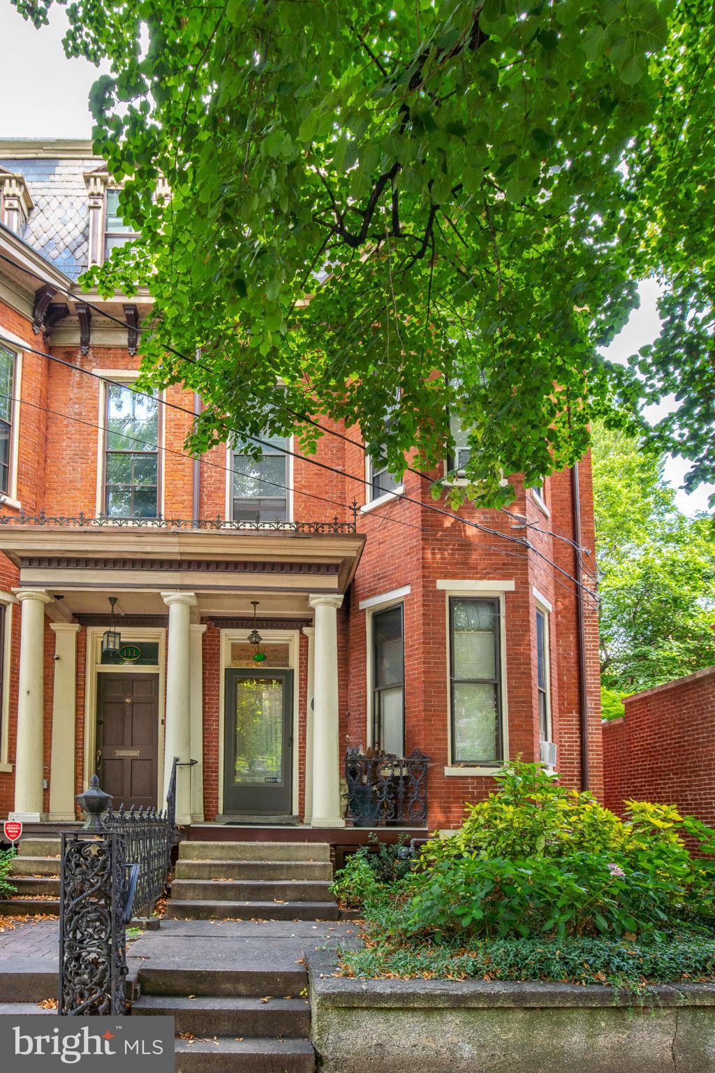 109 North Lime Street, Unit 2 Lancaster, PA 17602 - Photo 2 of 22 front view of a brick house with a small yard