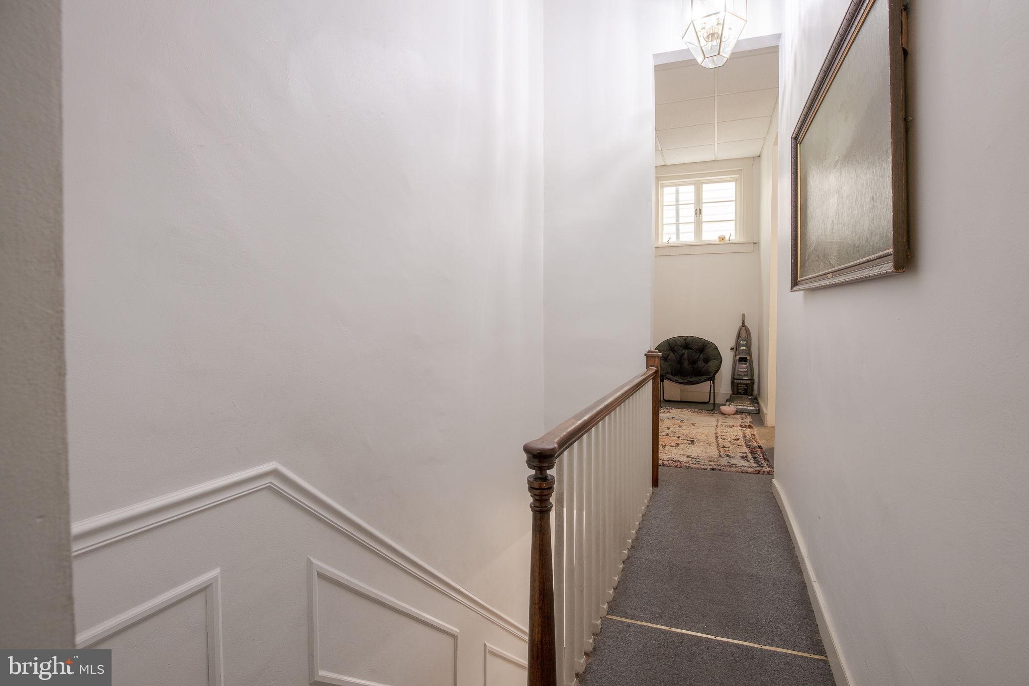 109 North Lime Street, Unit 2 Lancaster, PA 17602 - Photo 7 of 22 a view of a livingroom with wooden floor and staircase