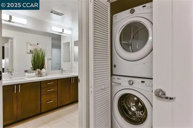 a view of a hallway with washer and dryer