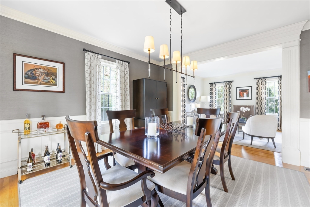 80 Emerson Road Needham, MA 02492 - Photo 13 of 41 a view of a dining room with furniture window and wooden floor