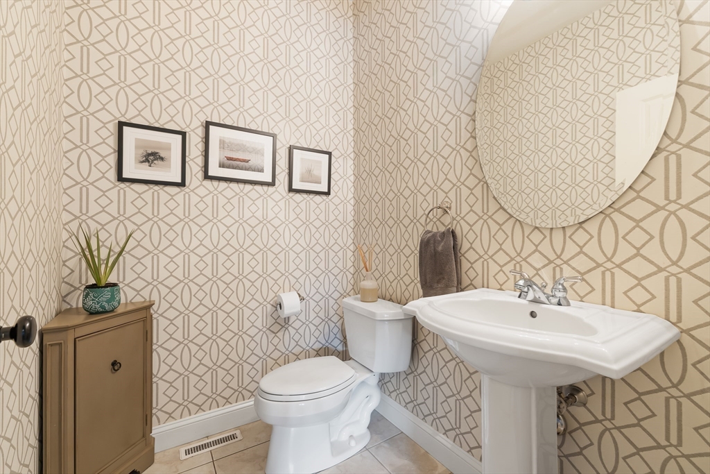 80 Emerson Road Needham, MA 02492 - Photo 17 of 41 a bathroom with a sink toilet and a mirror