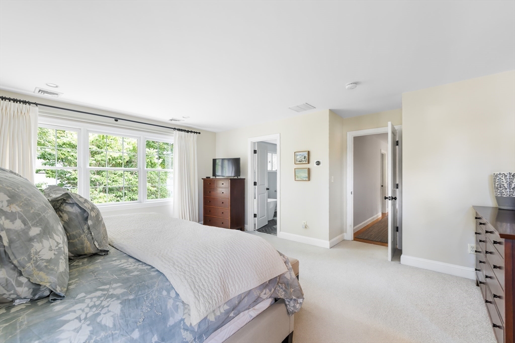 80 Emerson Road Needham, MA 02492 - Photo 19 of 41 a bed sitting in a spacious bedroom next to a window