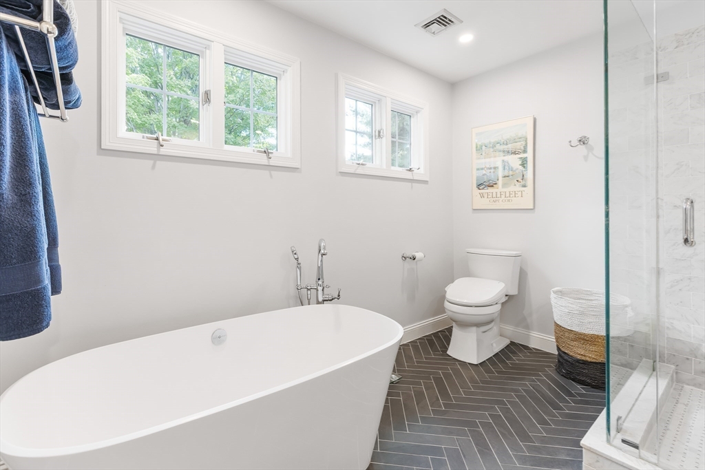 80 Emerson Road Needham, MA 02492 - Photo 21 of 41 a bathroom with a toilet and a bathtub