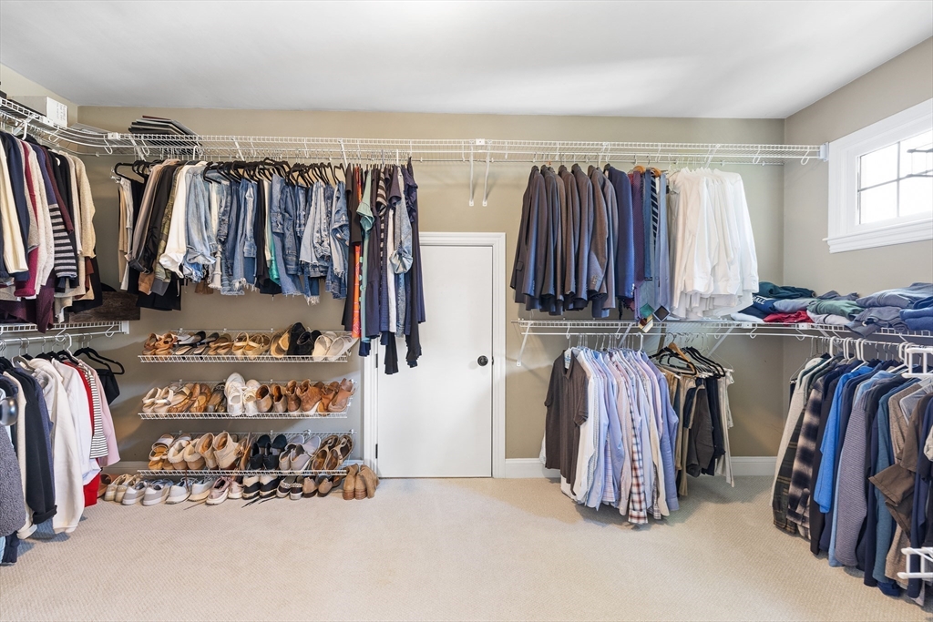 80 Emerson Road Needham, MA 02492 - Photo 23 of 41 a view of walk in closet with clothes