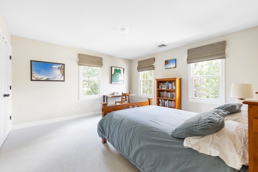 80 Emerson Road Needham, MA 02492 - Photo 24 of 41 a bedroom with a large bed and a window
