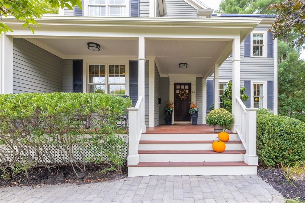 80 Emerson Road Needham, MA 02492 - Photo 3 of 41 a view of building with potted plants and seating space