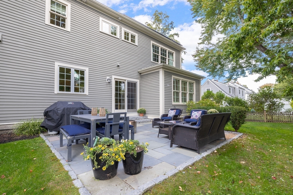 80 Emerson Road Needham, MA 02492 - Photo 35 of 41 a backyard of a house with seating space