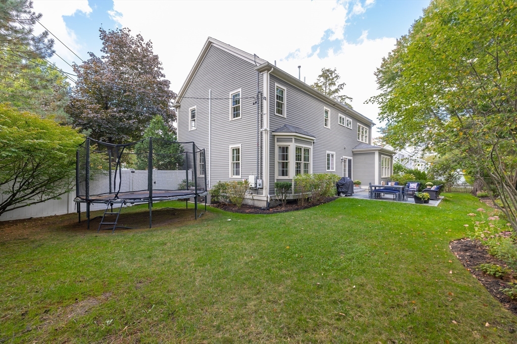 80 Emerson Road Needham, MA 02492 - Photo 40 of 41 a view of a house with a backyard
