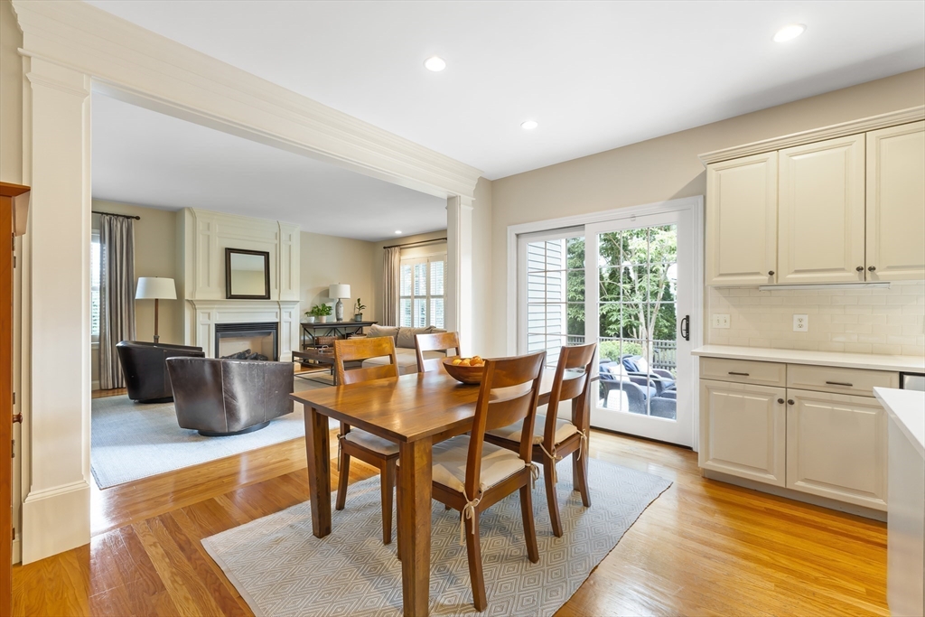 80 Emerson Road Needham, MA 02492 - Photo 9 of 41 a view of a dining room with furniture and wooden floor