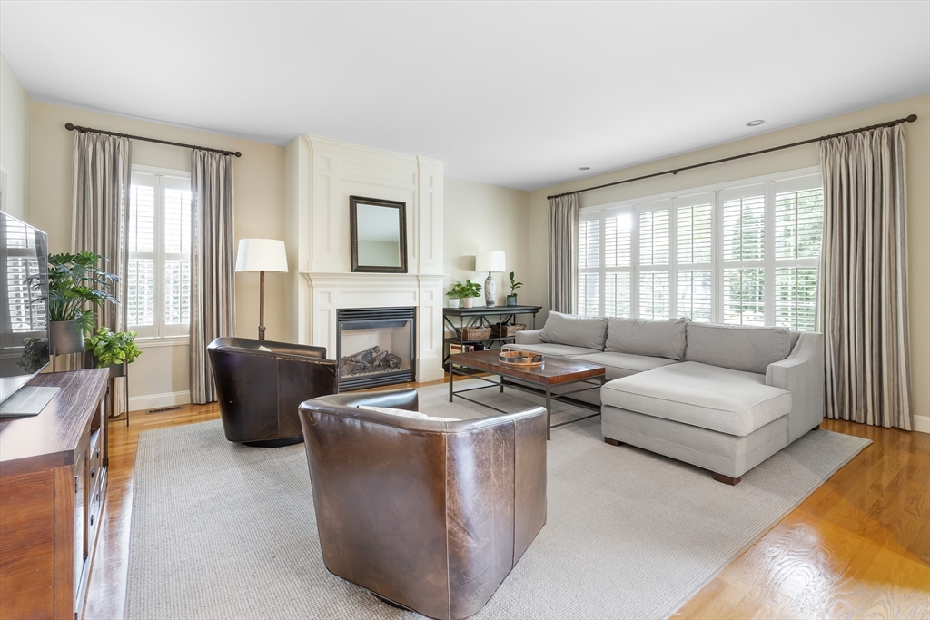 80 Emerson Road Needham, MA 02492 - Photo 10 of 41 a living room with fireplace furniture and a large window