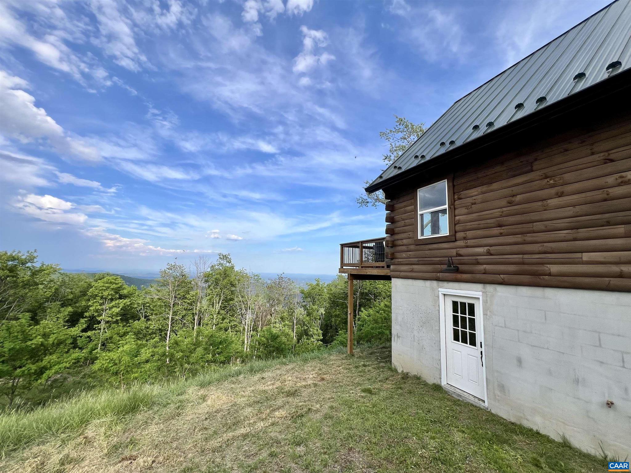 248 Raven Way Free Union, VA 22940 - Photo 44 of 47 a house view with a backyard space