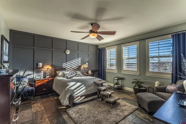 a bedroom with bed and a window