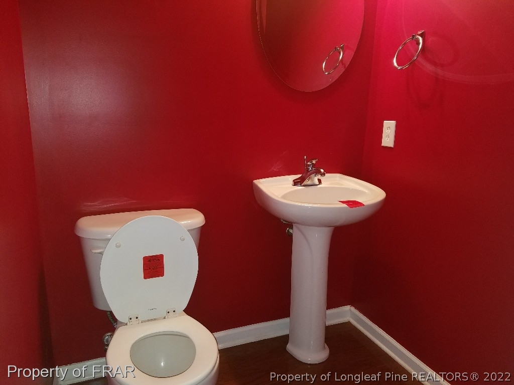 6715 Valley Falls Road Hope Mills, NC 28348 - Photo 6 of 13 a bathroom with a sink and a mirror
