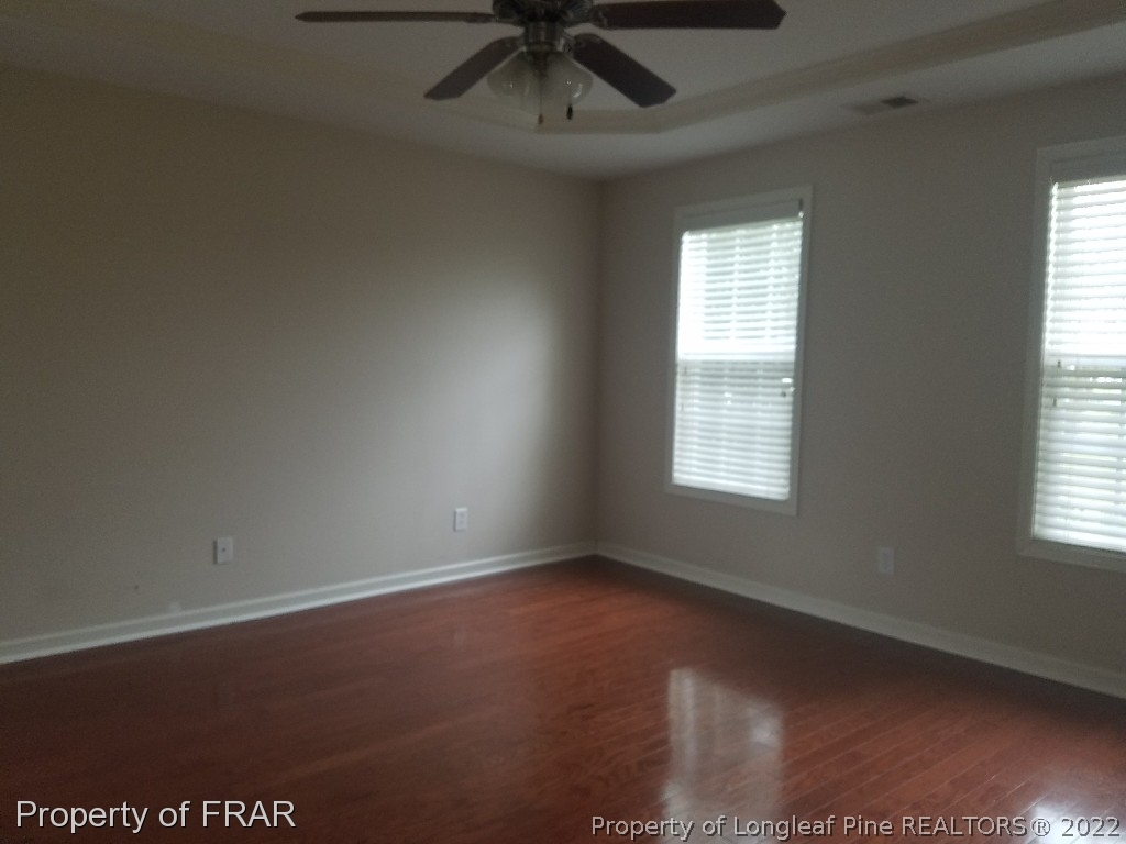 6715 Valley Falls Road Hope Mills, NC 28348 - Photo 7 of 13 an empty room with a window and a ceiling fan