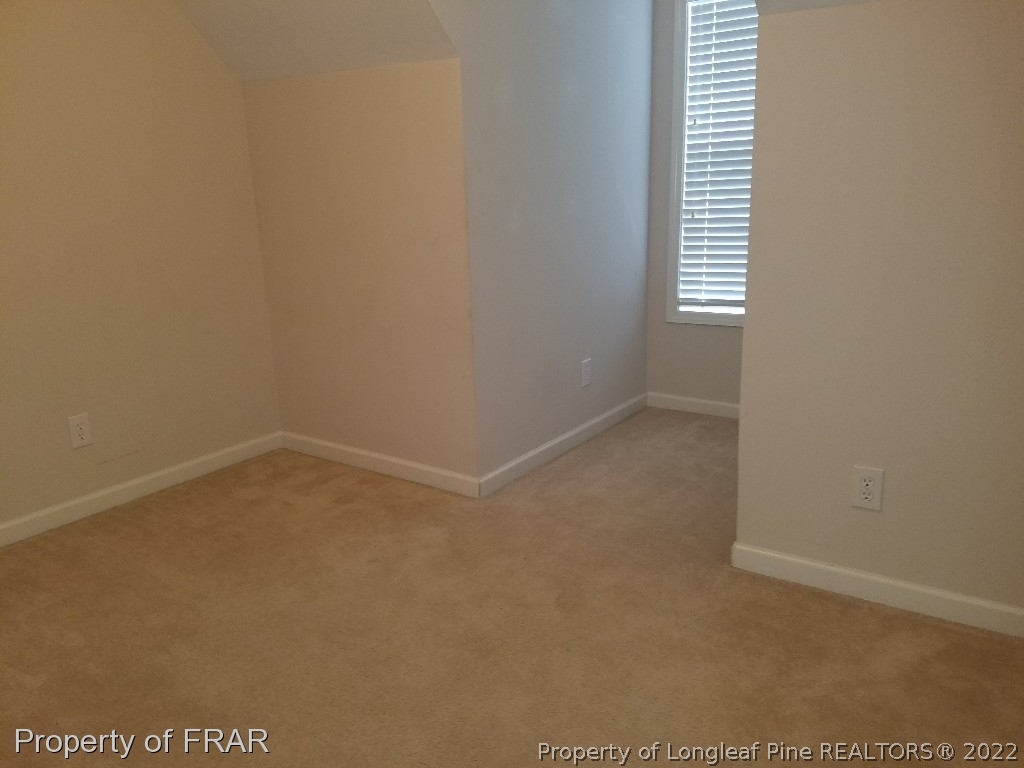 6715 Valley Falls Road Hope Mills, NC 28348 - Photo 9 of 13 a view of an empty room with a window