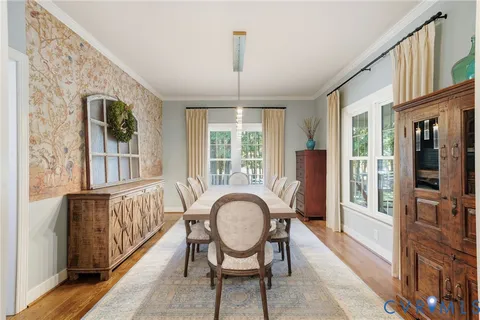 a view of a livingroom with furniture window and wooden floor