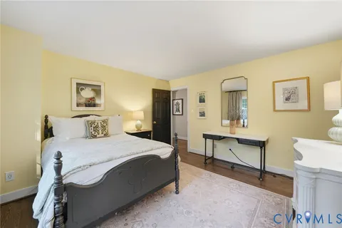 a bedroom with a bed and a table in it