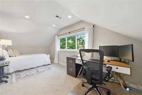 a bedroom with a workspace