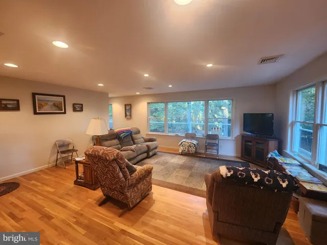 a living room with furniture fireplace and a flat screen tv