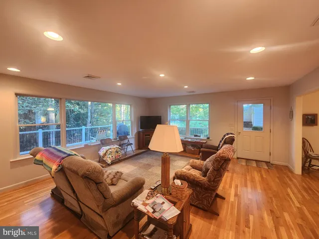 a living room with furniture and a table