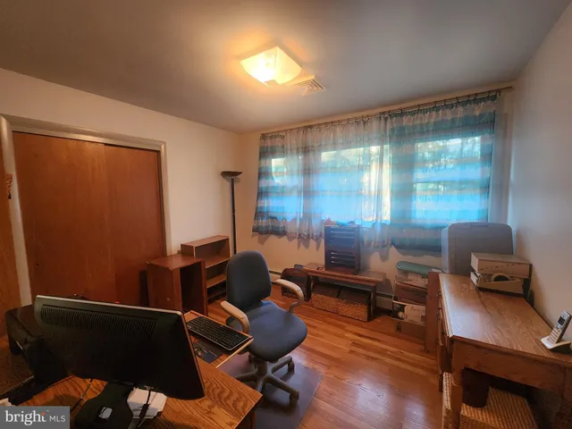 a room with furniture and wooden floor