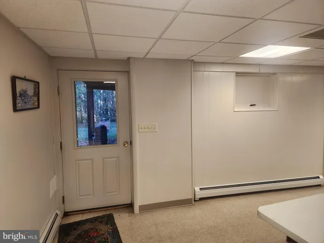 a view of an empty room with closet