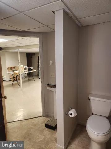a bathroom with a toilet and a sink