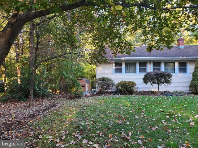 a front view of house with yard and outdoor seating