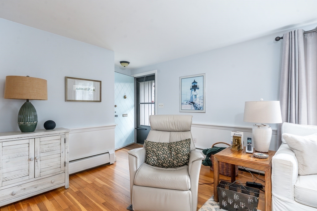 142 Chestnut Street Barnstable, MA 02601 - Photo 15 of 42 a living room with furniture and painting on the wall