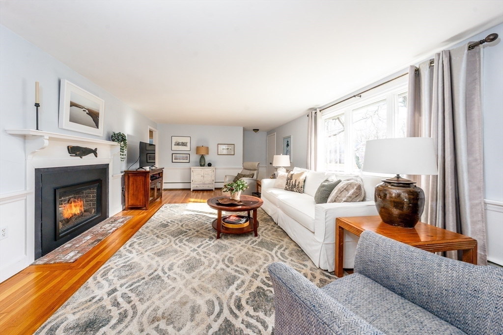 142 Chestnut Street Barnstable, MA 02601 - Photo 16 of 42 a living room with furniture and a fireplace