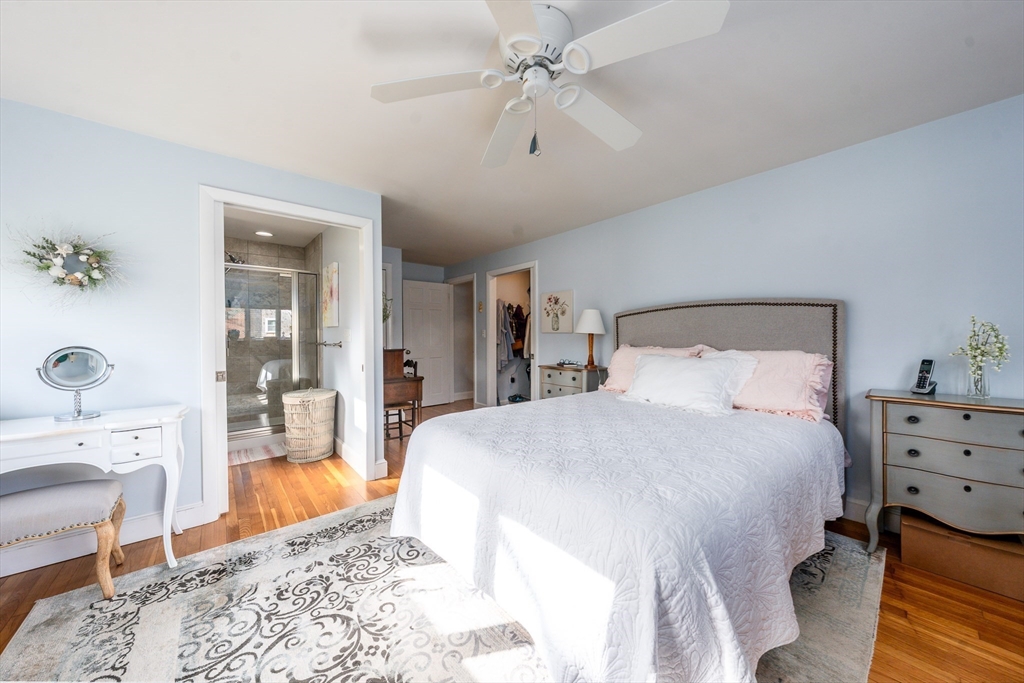 142 Chestnut Street Barnstable, MA 02601 - Photo 20 of 42 a bedroom with a bed and a chandelier