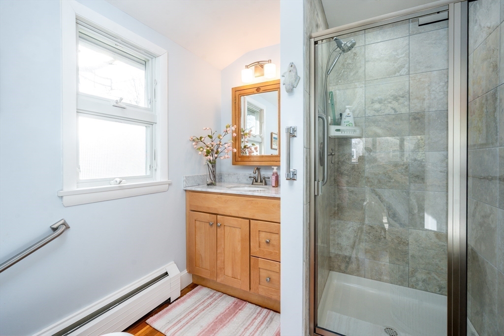 142 Chestnut Street Barnstable, MA 02601 - Photo 23 of 42 a bathroom with a shower and a sink