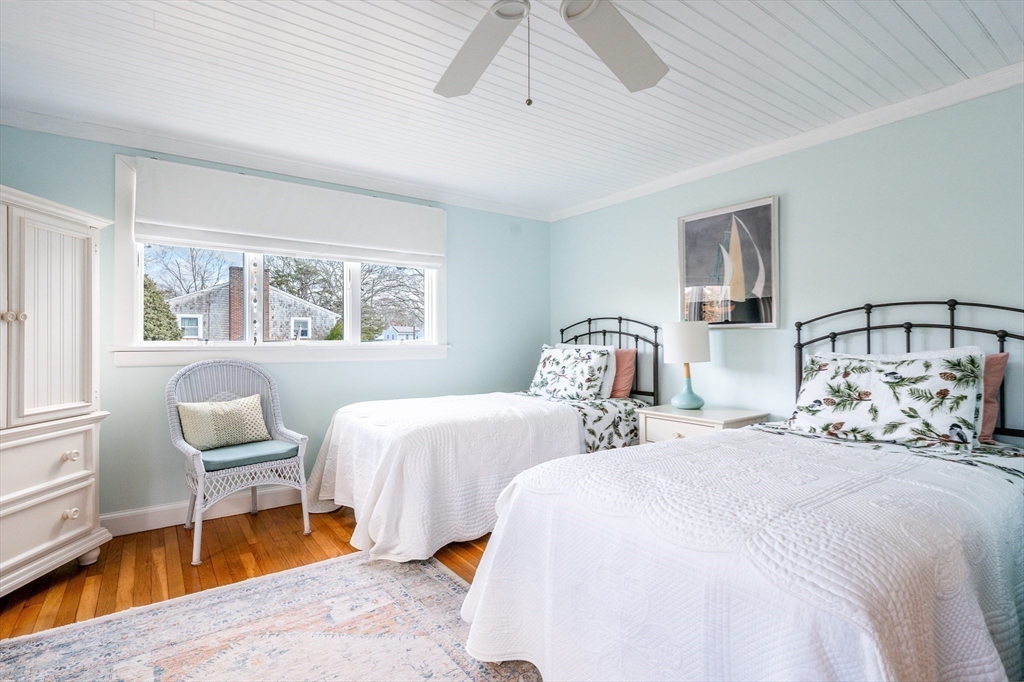 142 Chestnut Street Barnstable, MA 02601 - Photo 24 of 42 a bedroom with two beds and a chair