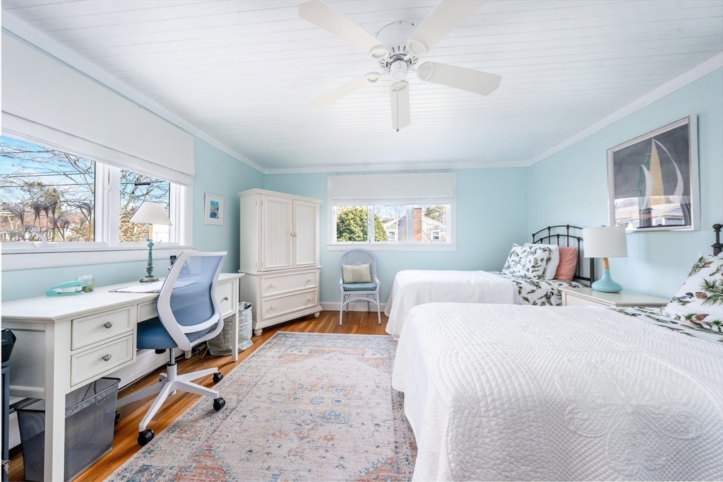 142 Chestnut Street Barnstable, MA 02601 - Photo 25 of 42 a bedroom with a bed and a chandelier