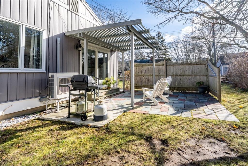 142 Chestnut Street Barnstable, MA 02601 - Photo 32 of 42 a view of a patio with a table and chairs