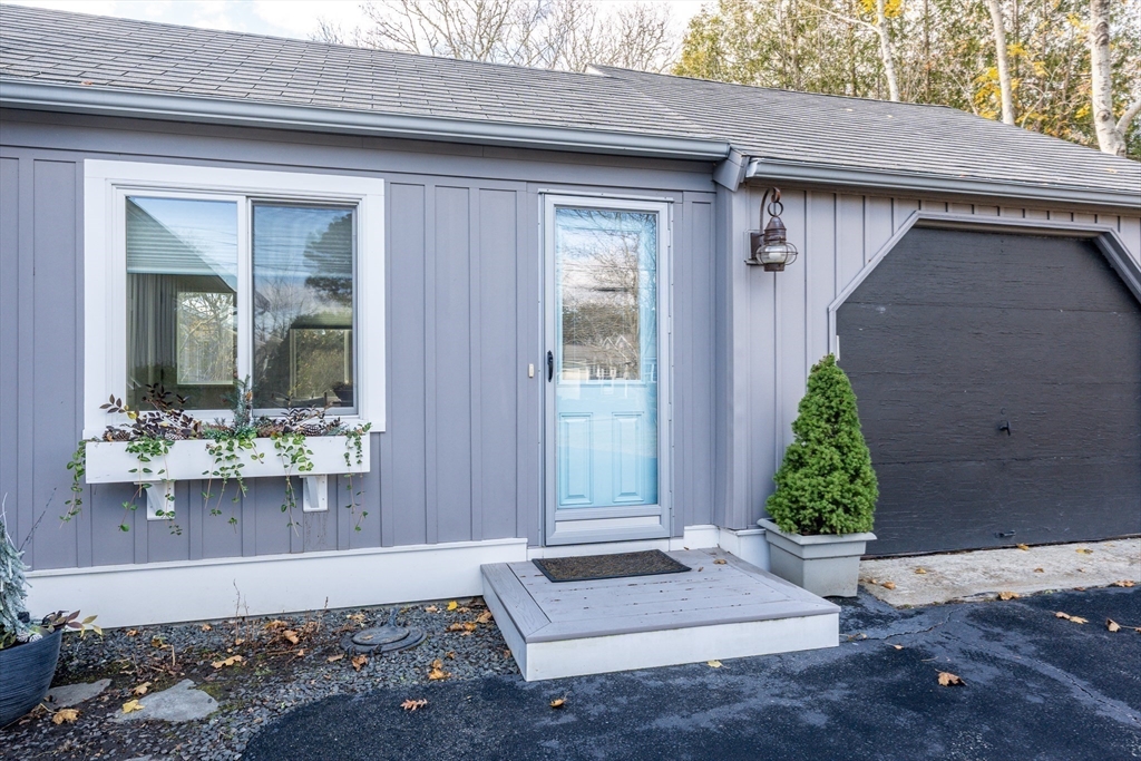142 Chestnut Street Barnstable, MA 02601 - Photo 6 of 42 a front view of a house with a yard