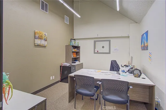 a view of a living room and dining room