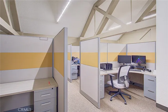 a view of a workspace with furniture