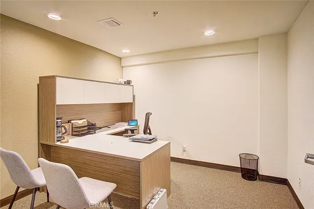 a view of an empty room with closet