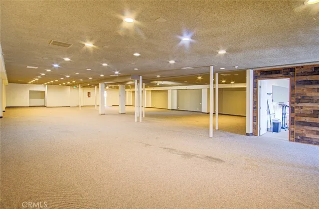 a view of a livingroom with wooden floor and a window
