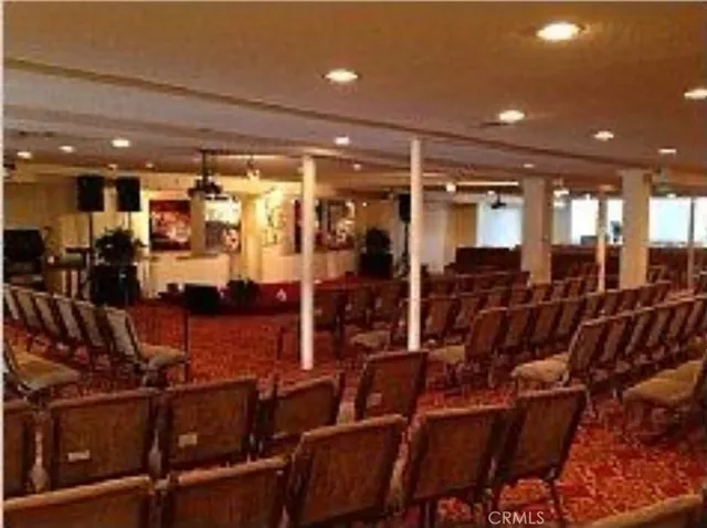 a room with stainless steel appliances and white cabinets