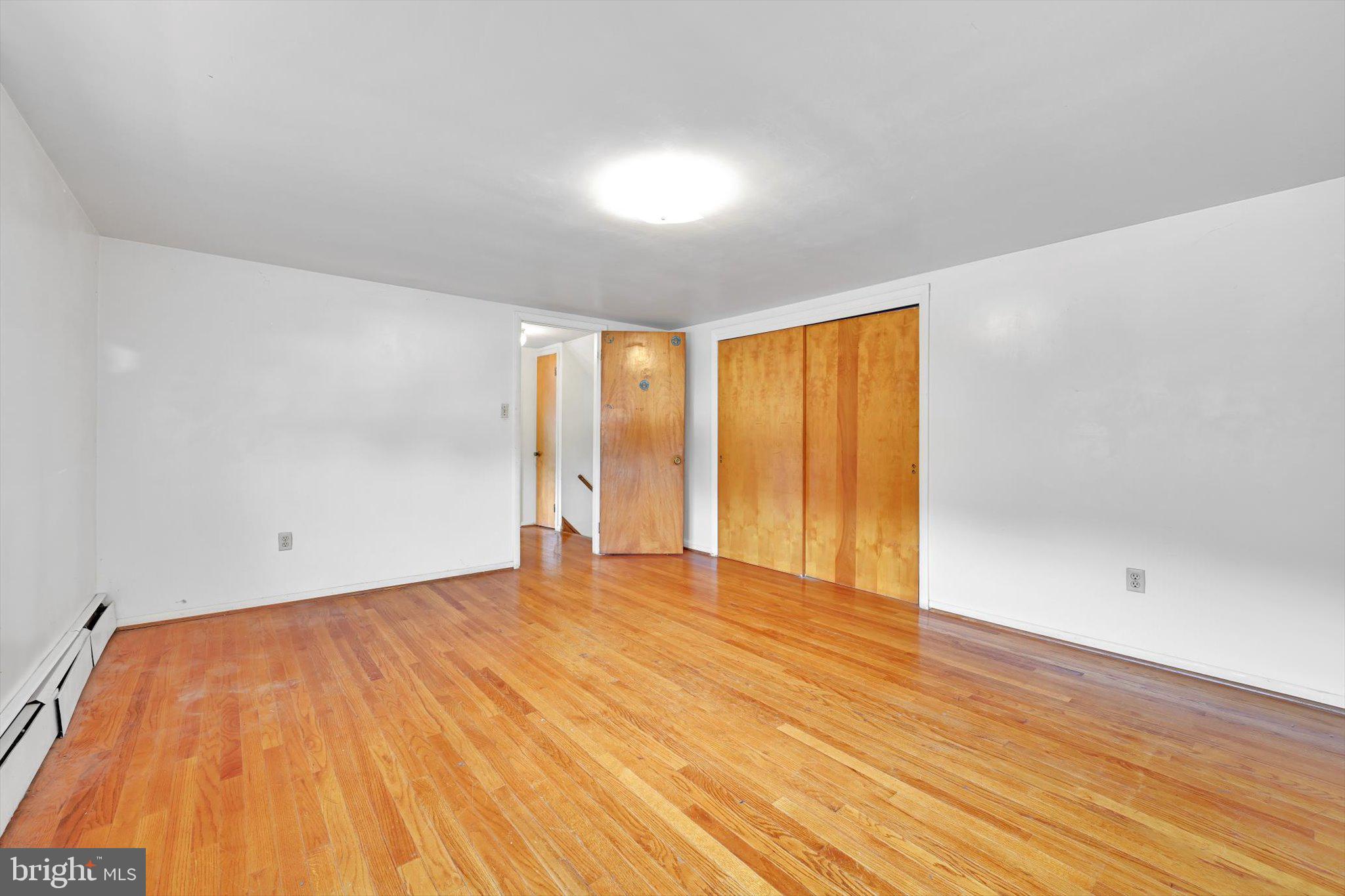 322 Morrison Road Reading, PA 19601 - Photo 18 of 29 a view of an empty room with wooden floor and a window