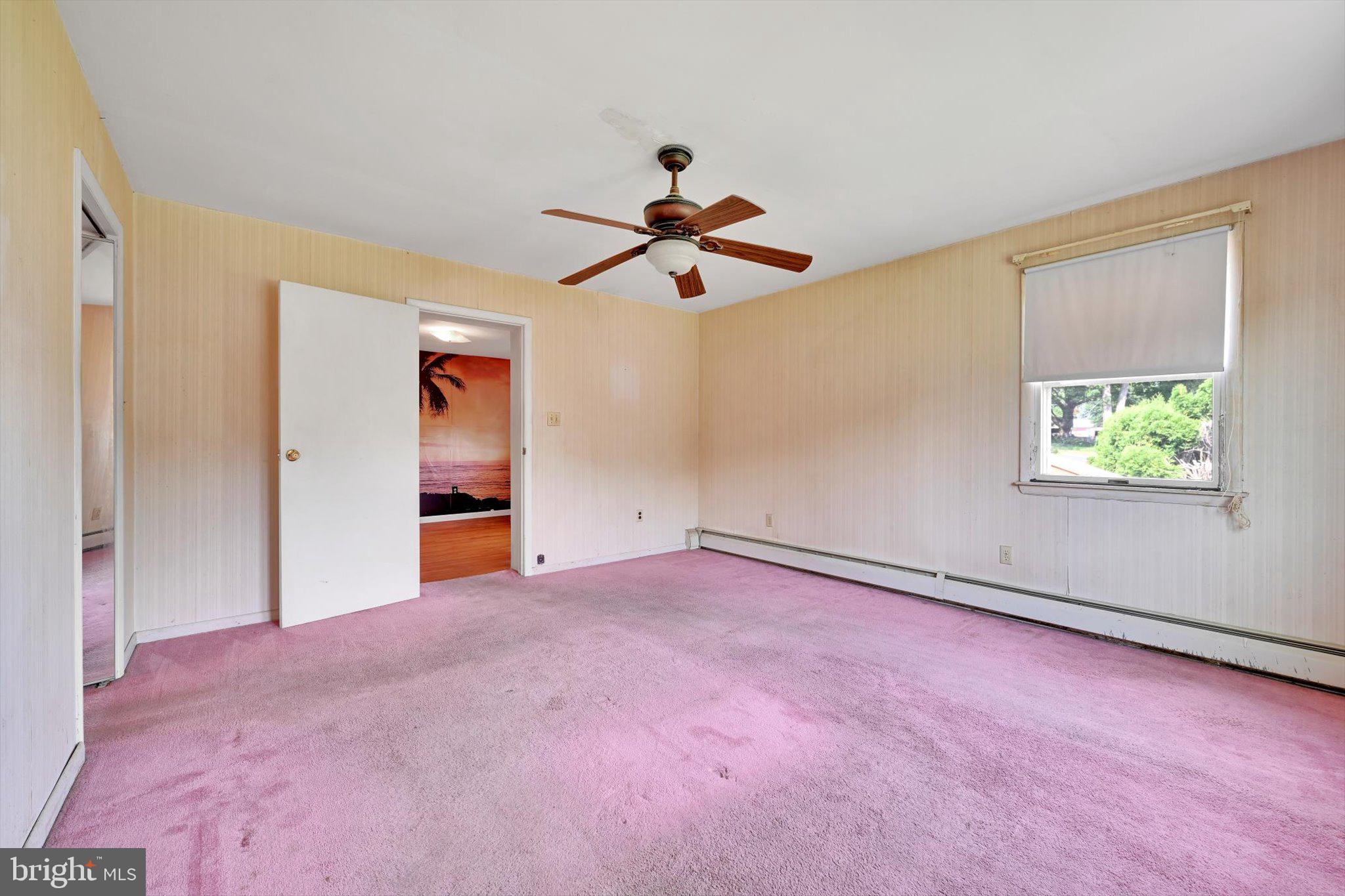 322 Morrison Road Reading, PA 19601 - Photo 20 of 29 an empty room with chandelier fan and windows