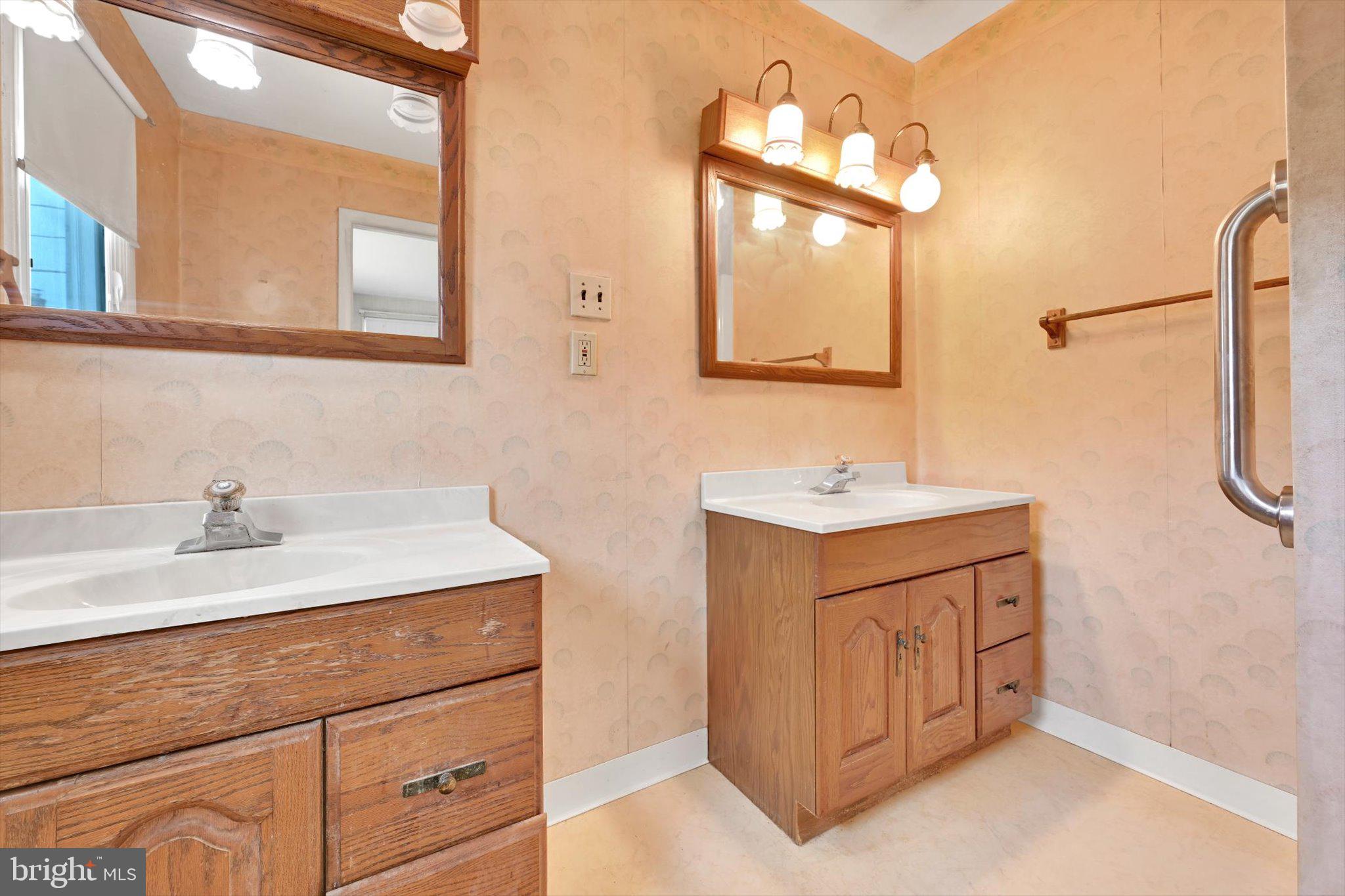 322 Morrison Road Reading, PA 19601 - Photo 21 of 29 a bathroom with a sink vanity granite and a mirror