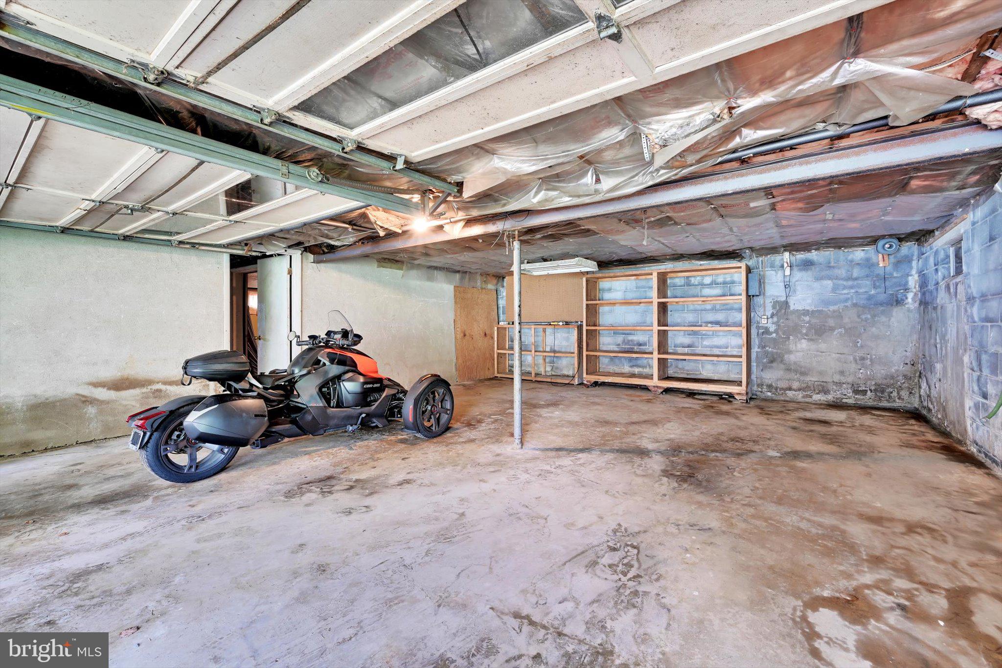 322 Morrison Road Reading, PA 19601 - Photo 26 of 29 a view of a garage with a bike and wooden roof