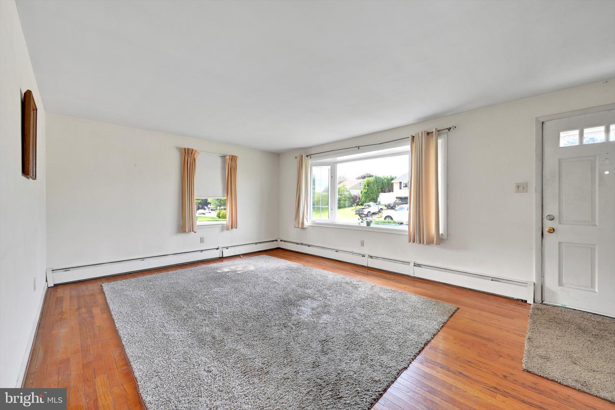 322 Morrison Road Reading, PA 19601 - Photo 4 of 29 wooden floor in an empty room with a window