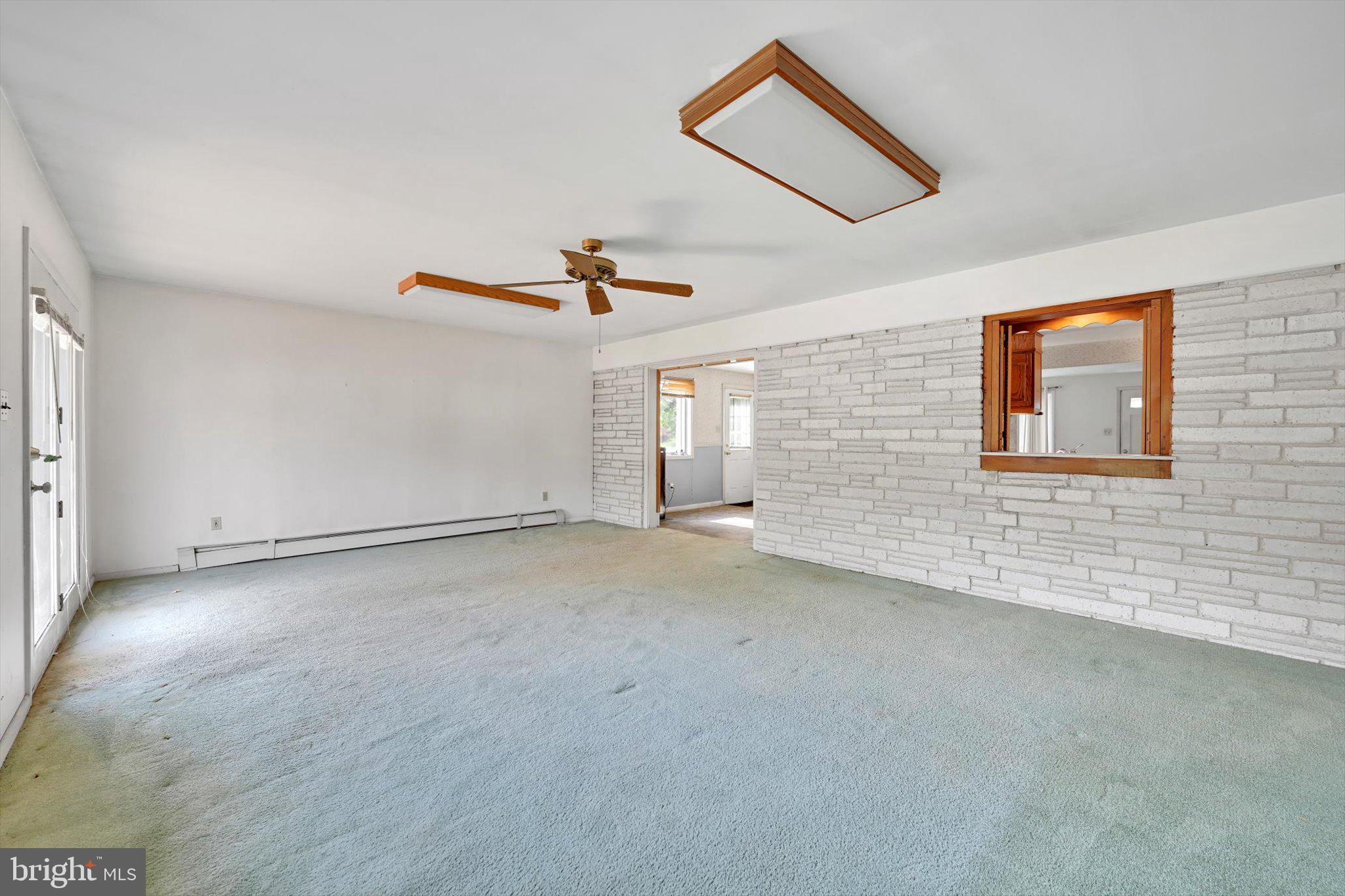 322 Morrison Road Reading, PA 19601 - Photo 10 of 29 a view of a livingroom with a ceiling fan and window