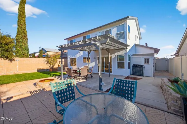 a view of a patio with couches table and chairs