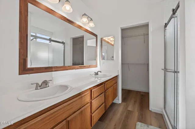 a bathroom with a glass shower door